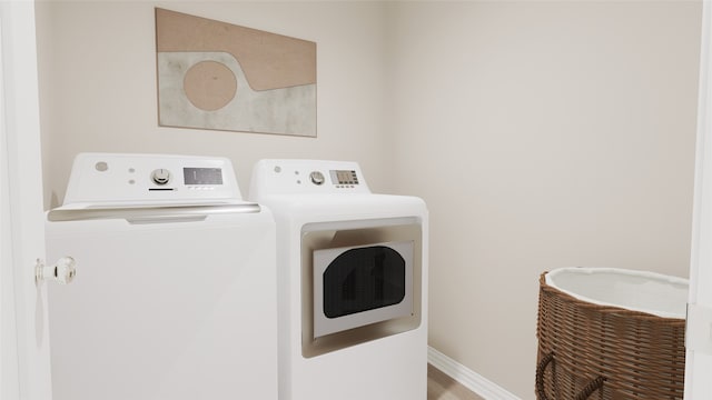 washroom featuring washing machine and clothes dryer