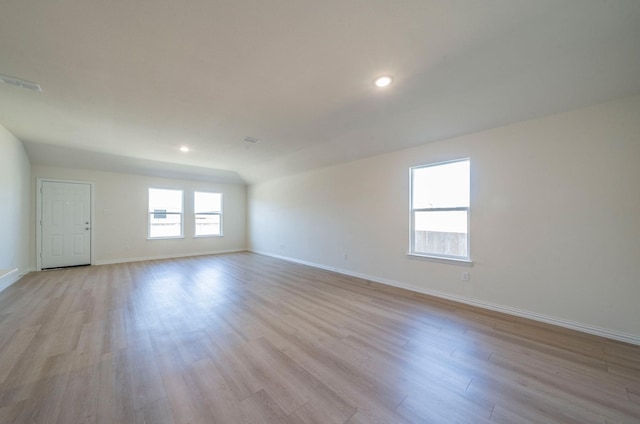 empty room with light hardwood / wood-style flooring