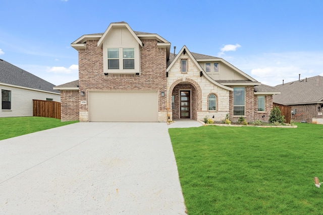 view of front of home featuring a garage and a front lawn