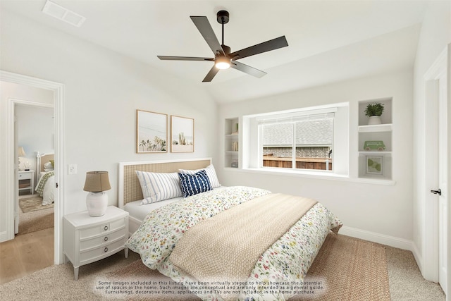 bedroom featuring light carpet, vaulted ceiling, and ceiling fan