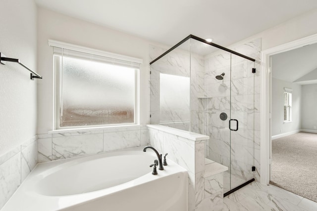 bathroom featuring separate shower and tub