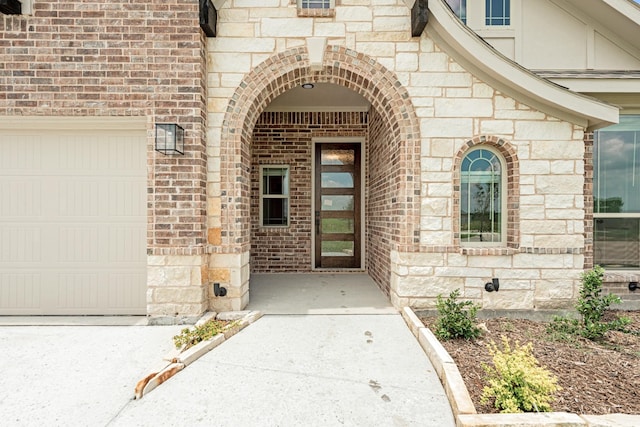 doorway to property featuring a garage