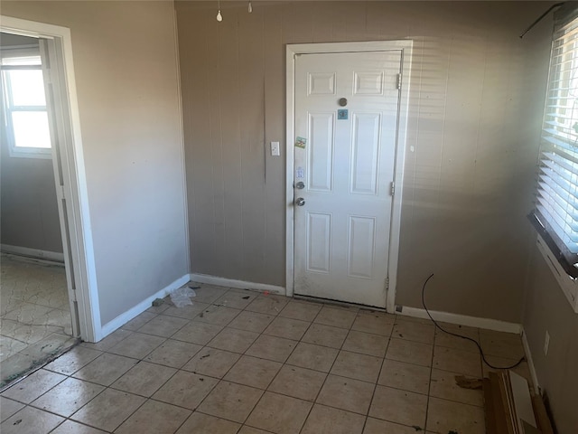 doorway featuring light tile floors