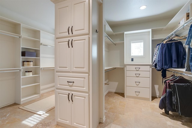 walk in closet featuring light tile patterned floors