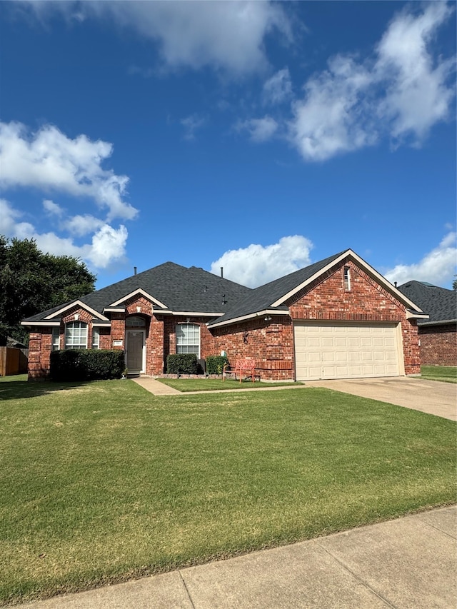 ranch-style house with a garage and a front lawn