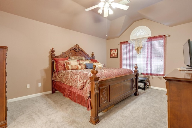 bedroom featuring ceiling fan, vaulted ceiling, and light carpet