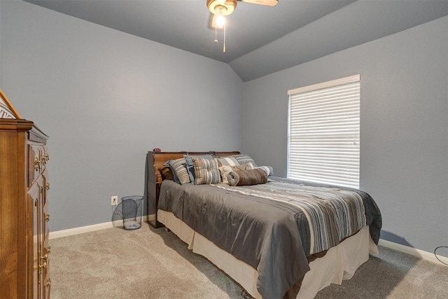 bedroom with carpet floors, ceiling fan, and vaulted ceiling