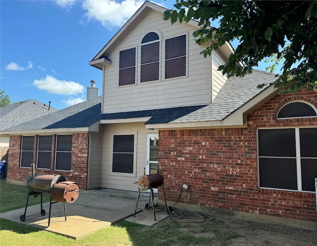 rear view of house with a patio