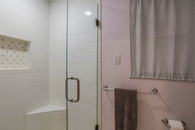 bathroom featuring an enclosed shower