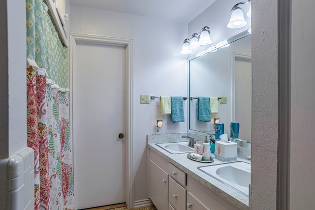 bathroom featuring double vanity