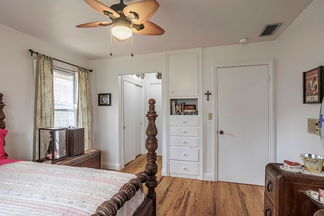 bedroom with light hardwood / wood-style floors and ceiling fan