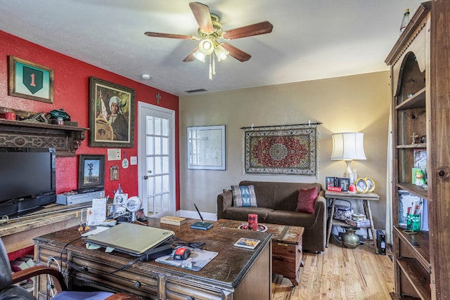 office area with ceiling fan and light hardwood / wood-style flooring