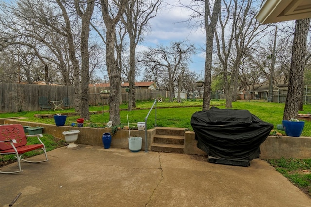 view of patio featuring a grill