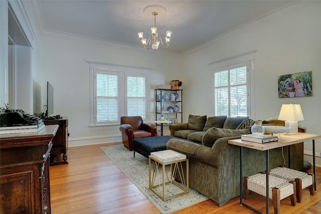 living room featuring light hardwood / wood-style floors, ornamental molding, and plenty of natural light