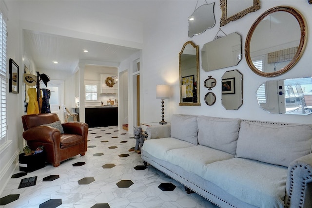 tiled living room featuring a healthy amount of sunlight