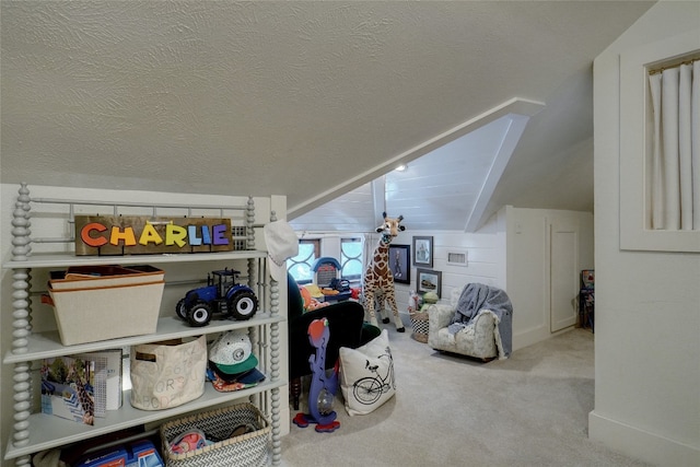 bonus room with lofted ceiling, a textured ceiling, and light colored carpet