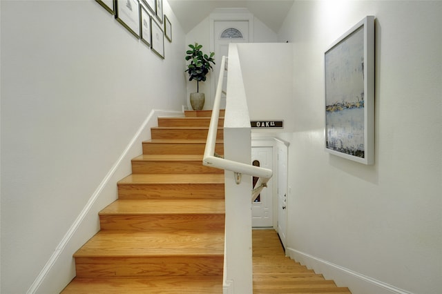 staircase featuring hardwood / wood-style floors