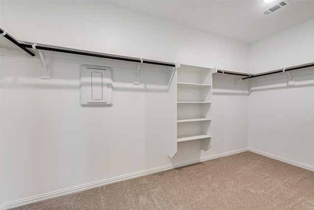 walk in closet featuring visible vents and carpet floors