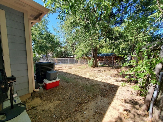 view of yard featuring central air condition unit