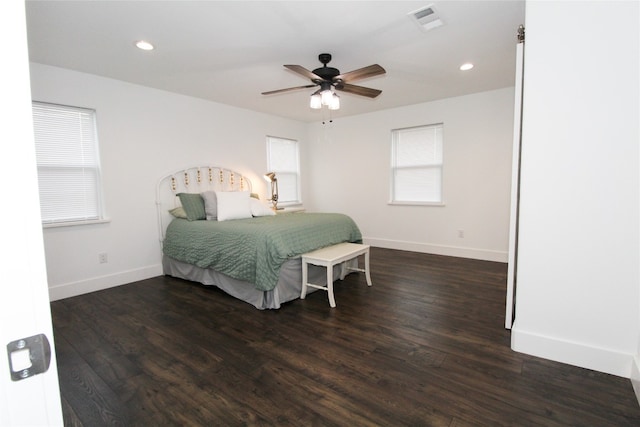 bedroom with ceiling fan and dark hardwood / wood-style floors