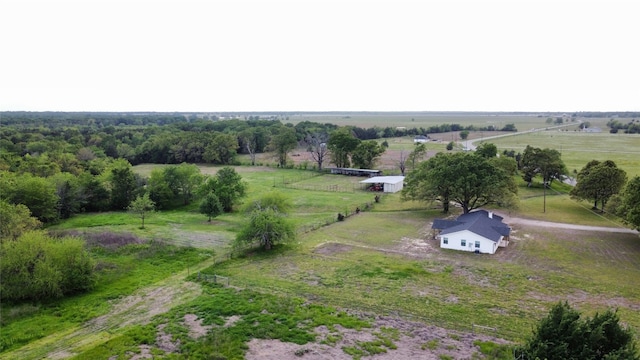 birds eye view of property with a rural view