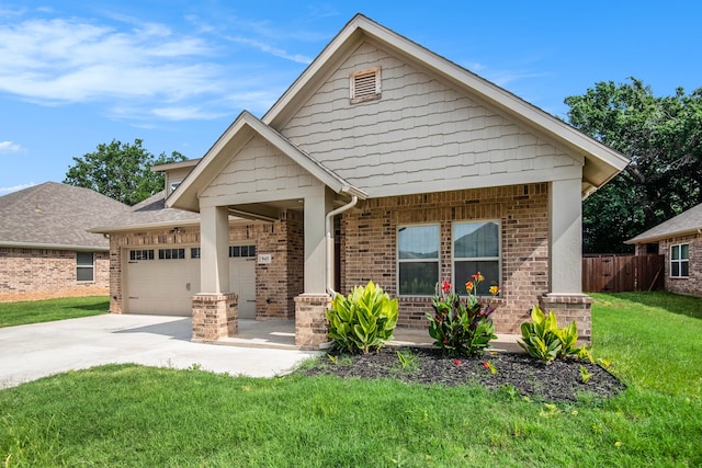 view of front of property featuring a front lawn and a garage