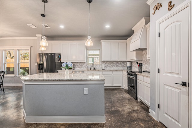 kitchen with plenty of natural light, appliances with stainless steel finishes, and tasteful backsplash