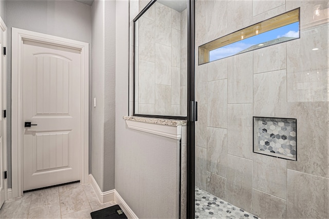 bathroom featuring walk in shower and tile floors