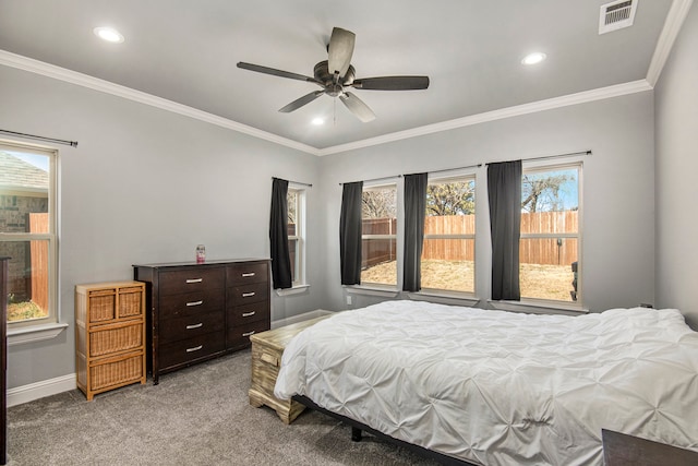 bedroom with crown molding, carpet, and ceiling fan