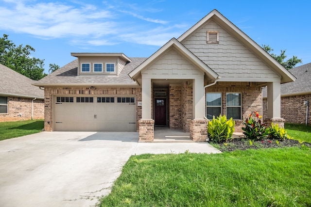 craftsman-style home with a garage and a front lawn