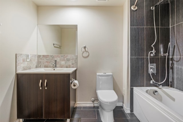 full bathroom featuring vanity, tile flooring, toilet, and washtub / shower combination