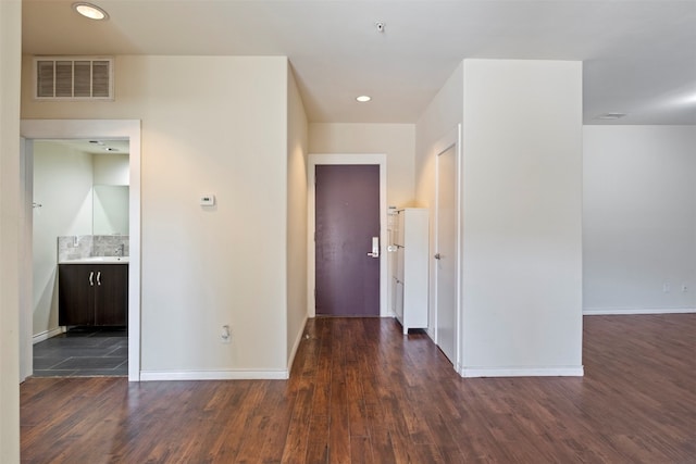 interior space featuring sink and dark hardwood / wood-style flooring