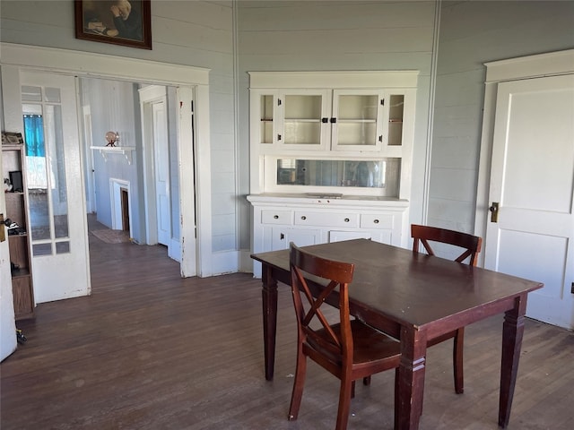 dining area with dark hardwood / wood-style flooring