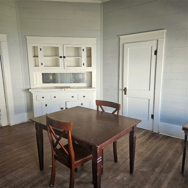 dining area with dark hardwood / wood-style flooring