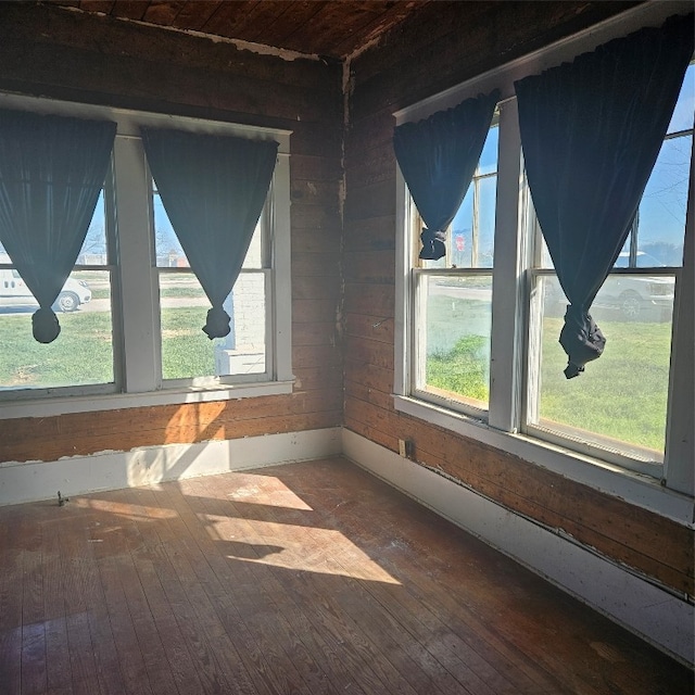 unfurnished sunroom with a wealth of natural light