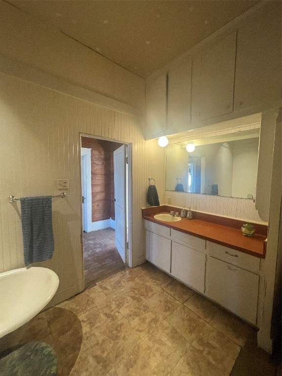 bathroom featuring tile flooring and vanity