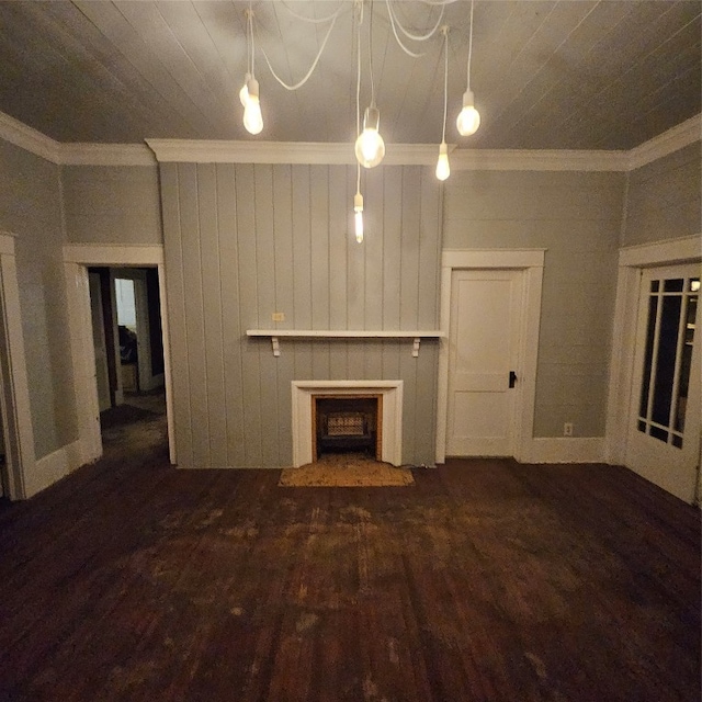 unfurnished living room with crown molding and dark hardwood / wood-style flooring