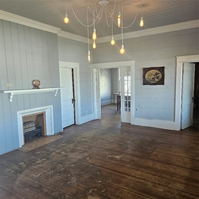 unfurnished living room with an inviting chandelier and dark wood-type flooring