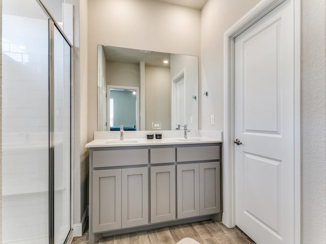 bathroom with vanity and an enclosed shower