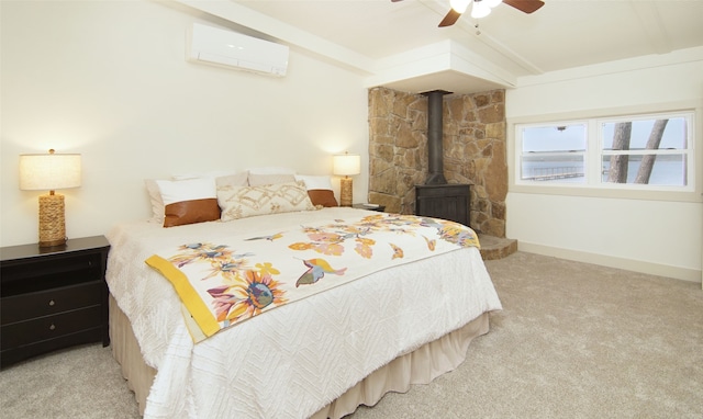 carpeted bedroom featuring a wood stove, vaulted ceiling, ceiling fan, and a wall mounted AC