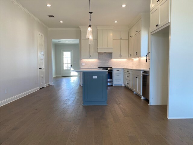 kitchen featuring custom exhaust hood, gas stove, built in microwave, and white cabinetry