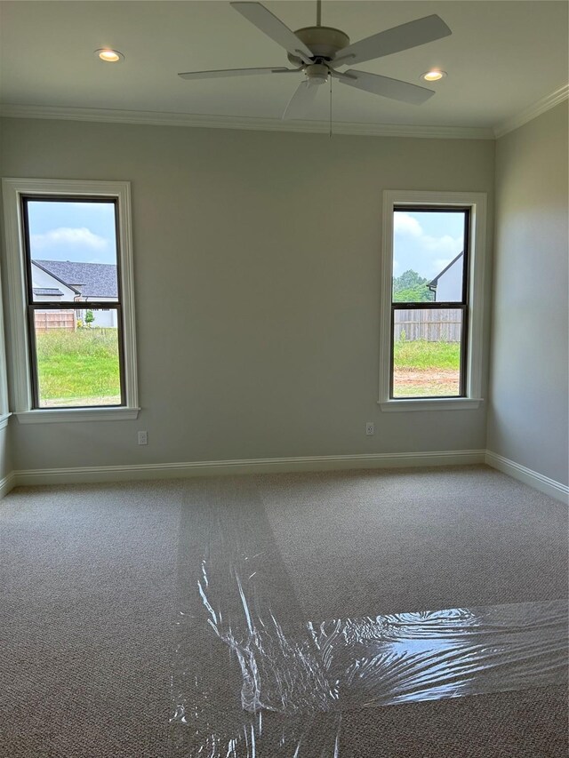 unfurnished bedroom with ornamental molding and light colored carpet