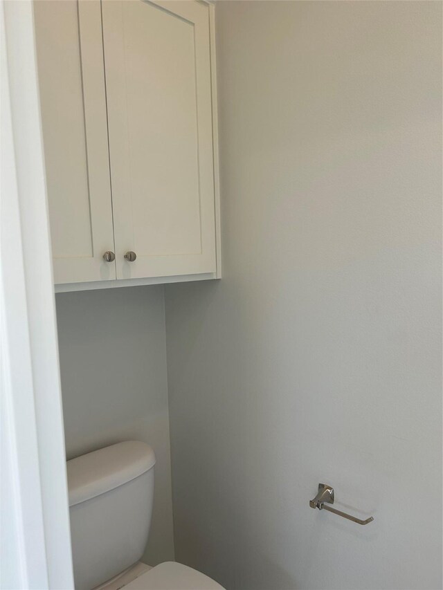 bathroom with crown molding, tile patterned floors, and vanity