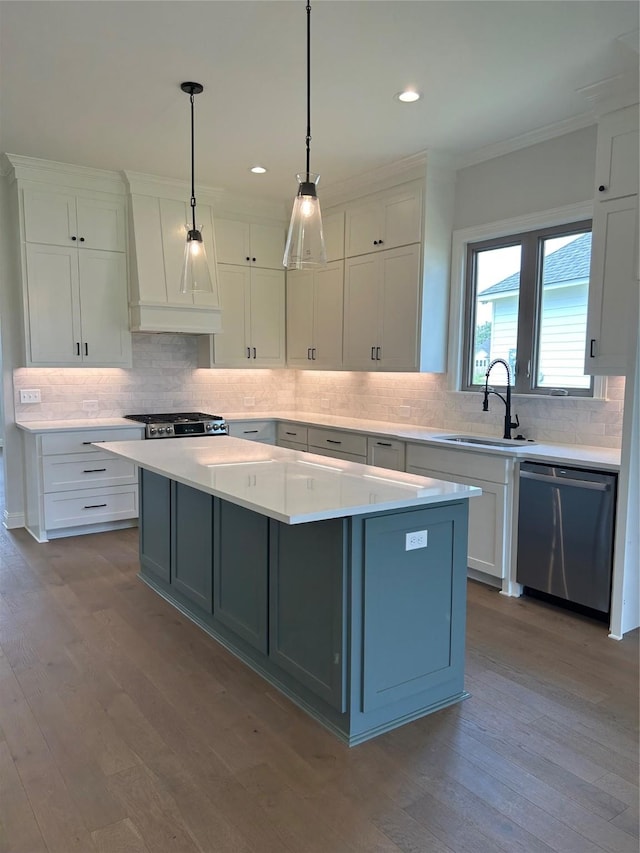 kitchen with premium range hood, a sink, a center island, light countertops, and dishwasher