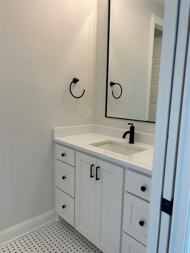 bathroom featuring vanity and baseboards