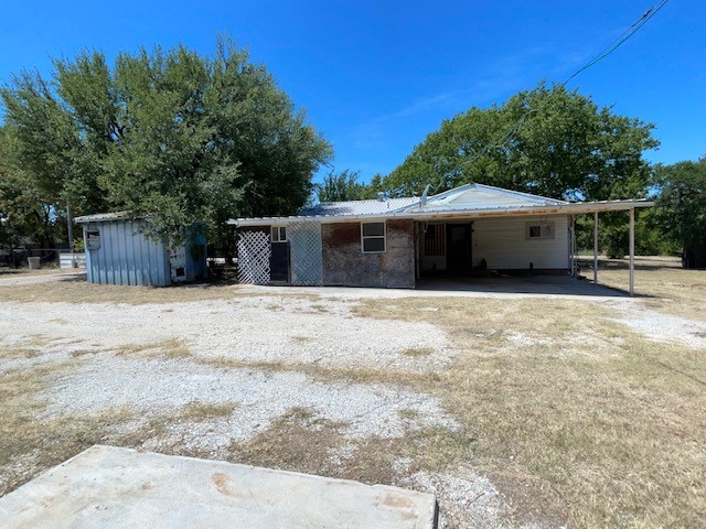 exterior space featuring a carport