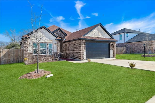 view of front of house with a front yard and a garage