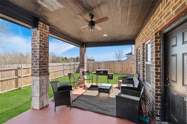 view of patio / terrace with ceiling fan and an outdoor hangout area