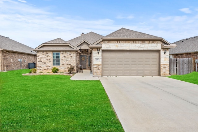 view of front facade featuring central AC unit, a front lawn, and a garage