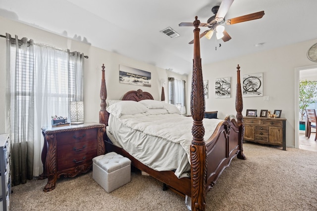 bedroom featuring ceiling fan and light carpet